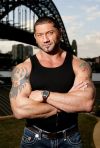 dave batista dragon and flag tattoo on arm